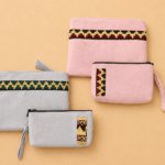 pouch bahan suede warna sage dan pink dengan motif khas Lampung, desain elegan untuk souvenir pernikahan, hempers, dan sorporate gift